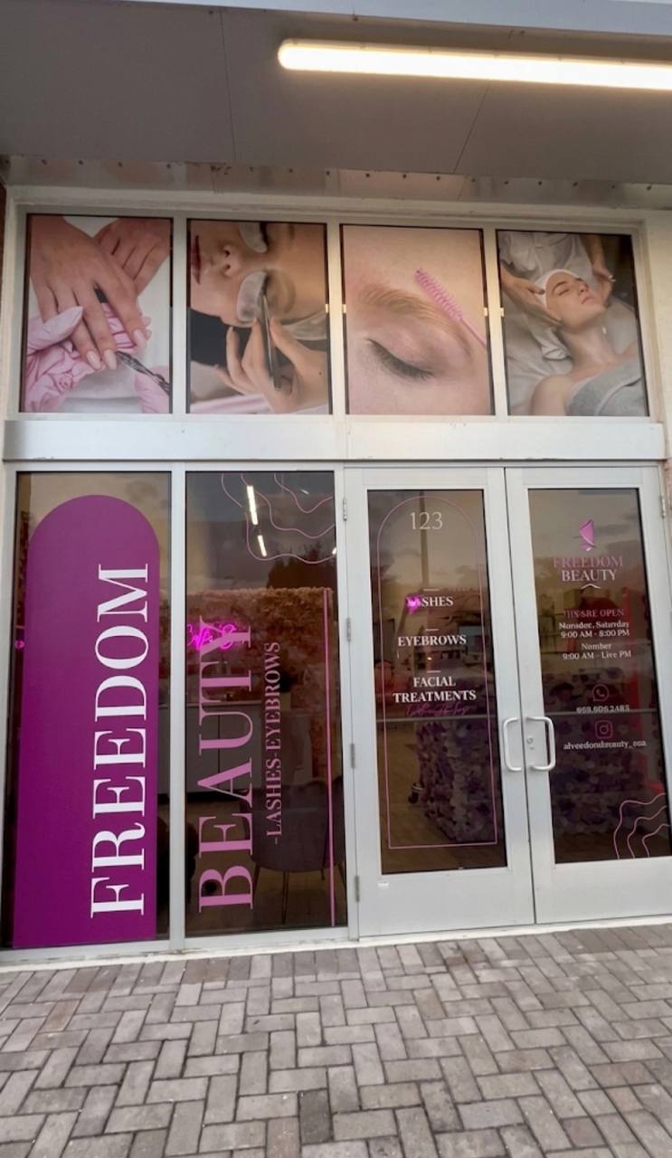 Freedom Beauty storefront window vinyl and signage installed by KStell Studio in Miami